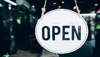 Close-up of Open sign on glass door